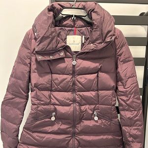 Mid long Moncler jacket with a foldable hood